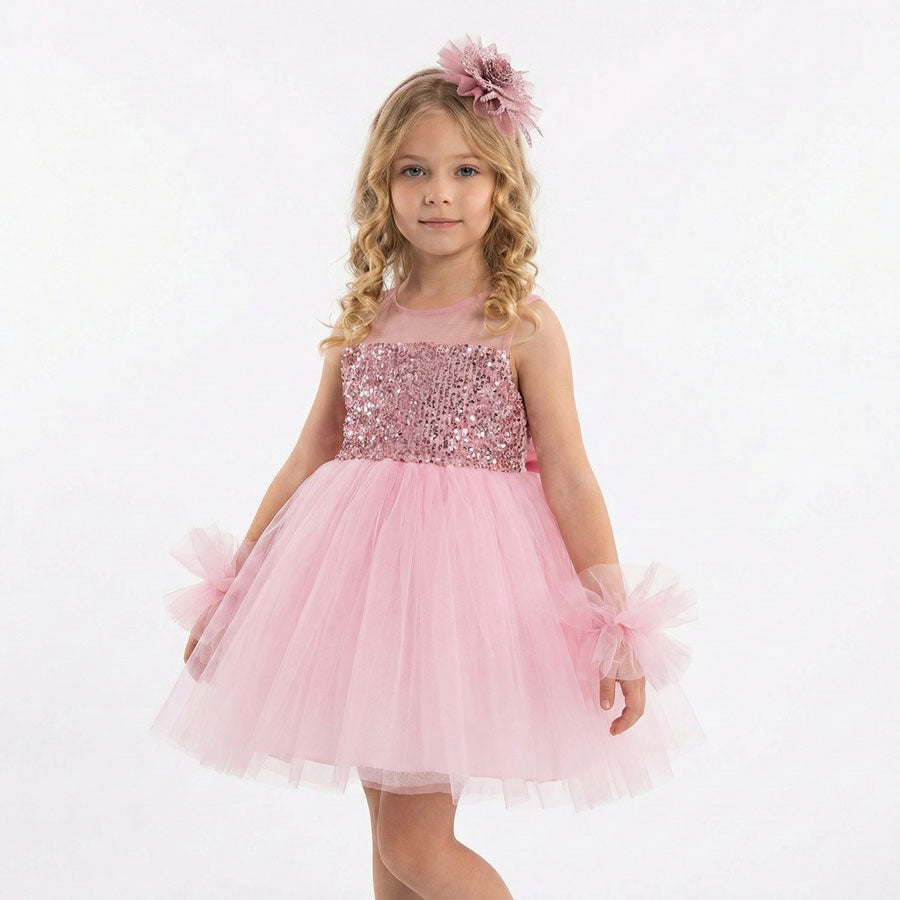 Pembe, mor ve beyaz renk seçenekli, kolları tülden ponpon detaylı payetli kız çocuk abiye elbise