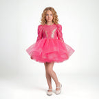 Arkası fiyonk detaylı, beyaz tüllü ve uzun kollu kız çocuk özel gün kıyafeti.