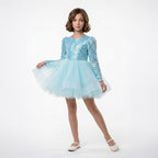 Arkası fiyonk detaylı, beyaz tüllü ve uzun kollu kız çocuk özel gün kıyafeti.